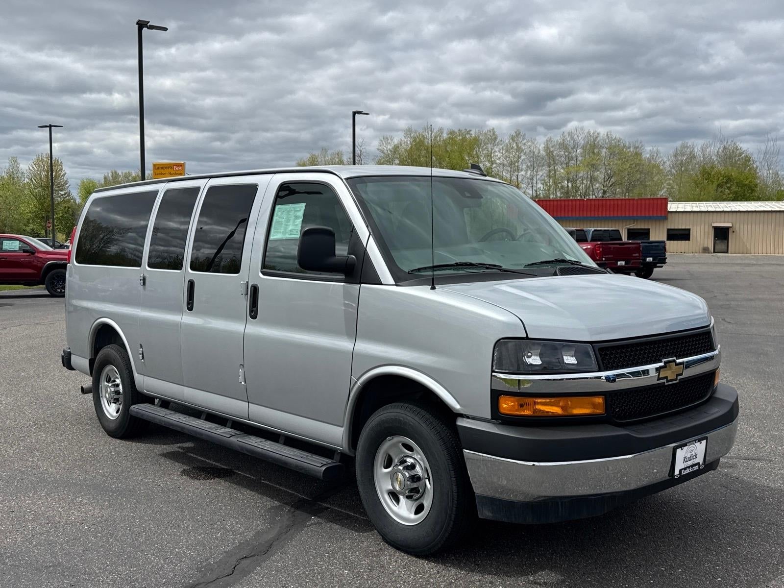 2025 Chevrolet Express Passenger 1LT in Silver Ice Metallic — front three-quarter view