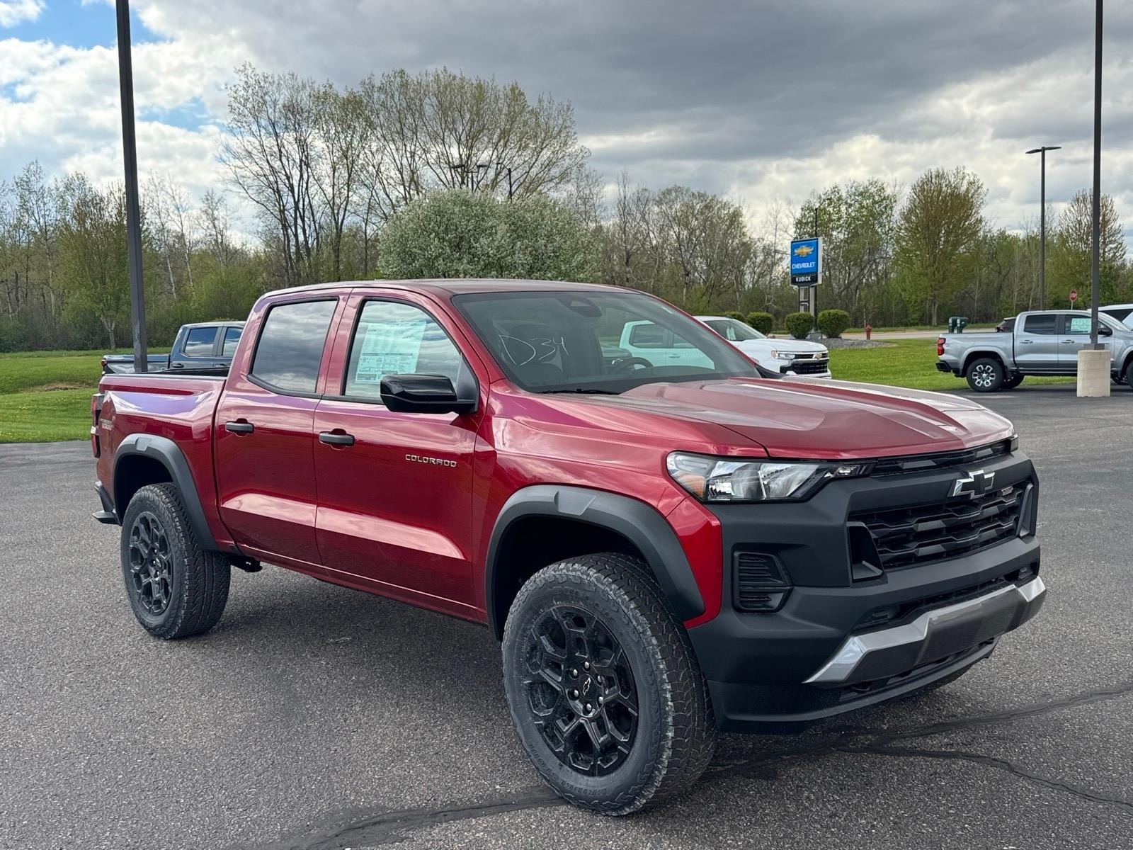 2026 Chevrolet Colorado Trail Boss in Radiant Red Tintcoat — front three-quarter view