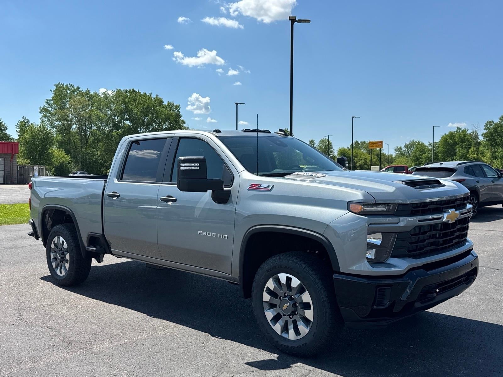 2026 Chevrolet Silverado 2500 HD Custom in Sterling Gray Metallic — front three-quarter view