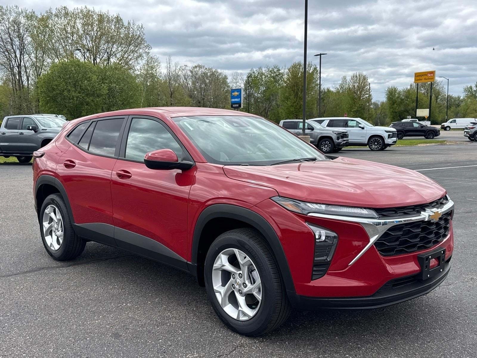 2026 Chevrolet Trax LS in Apex Red — front three-quarter view