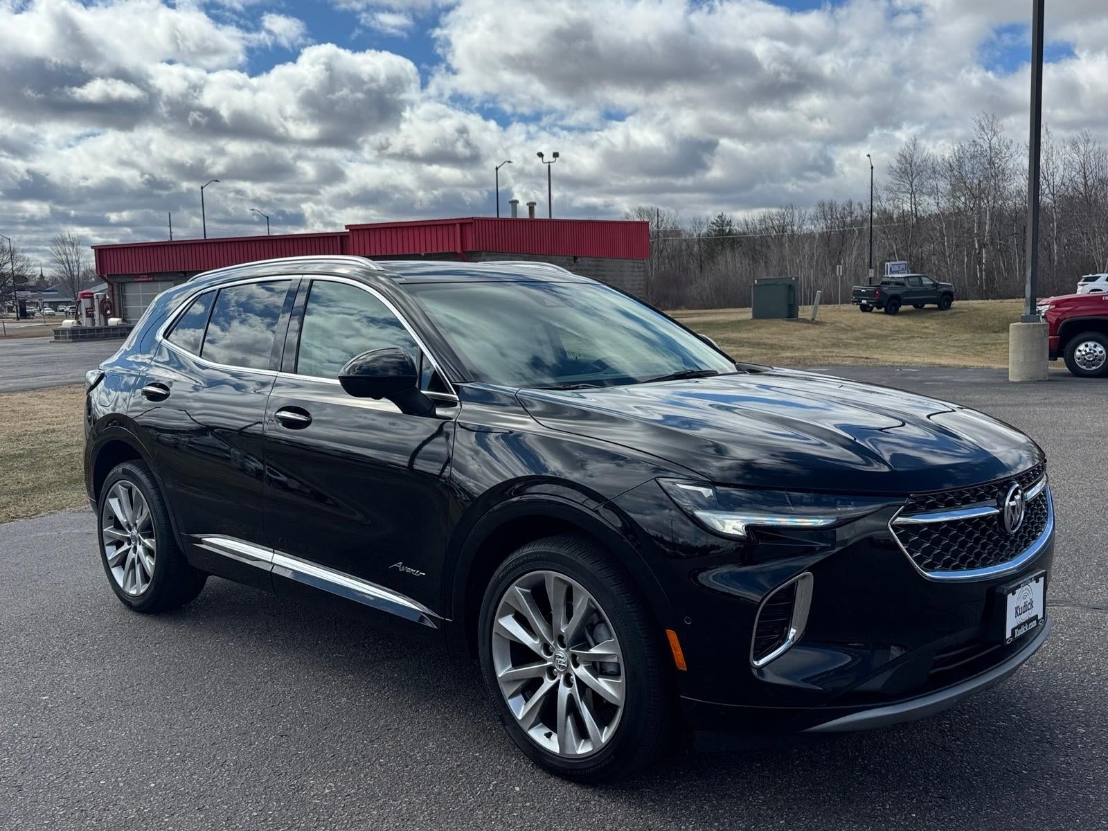2023 Buick Envision Avenir in Ebony Twilight Metallic — front three-quarter view